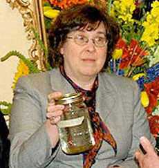 Bev May with water sample Feb 2011