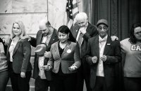 Attendees gather for the closing prayer. Special thanks to Steve Pavey for taking this photo.